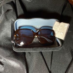 Gucci 59mm a brown Frame with Blue Tint.